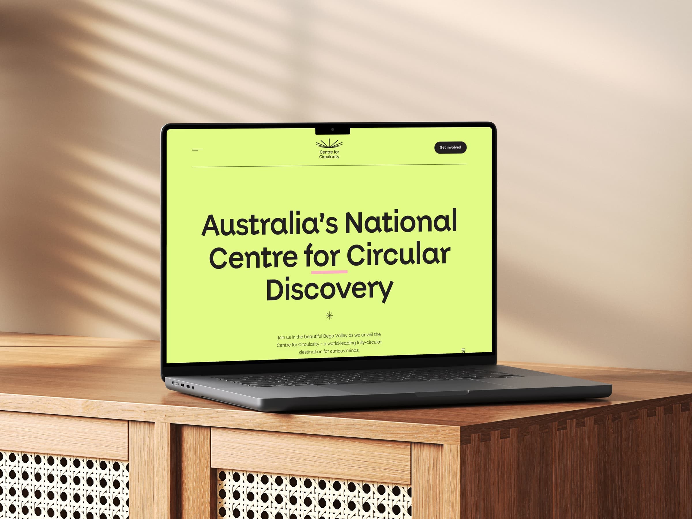 MacBook Air mock-up showing the Centre for Circularity microsite with its lime opening page and circular discovery proposition.