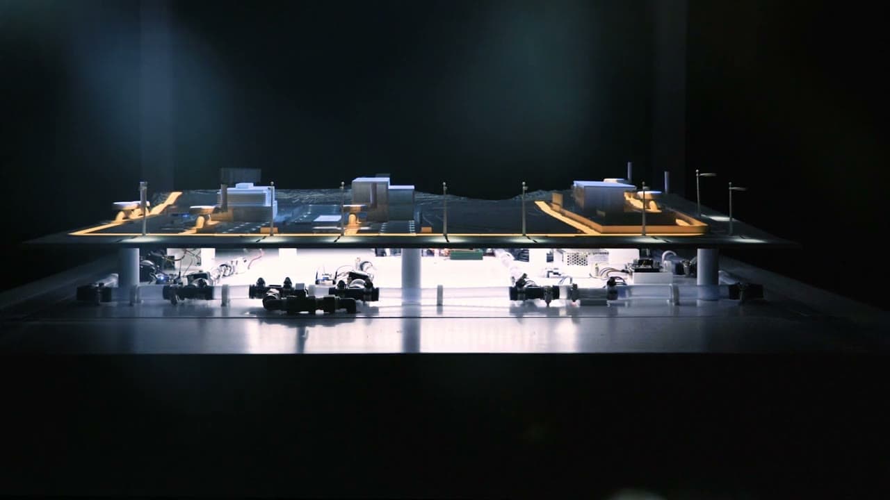 Five-second sequence moving from the complete H2.0 stand into low frontal views of the finished model and water system.