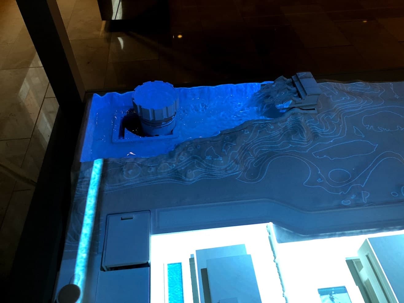 Close view of water escaping at a corner of the H2.0 model during testing.