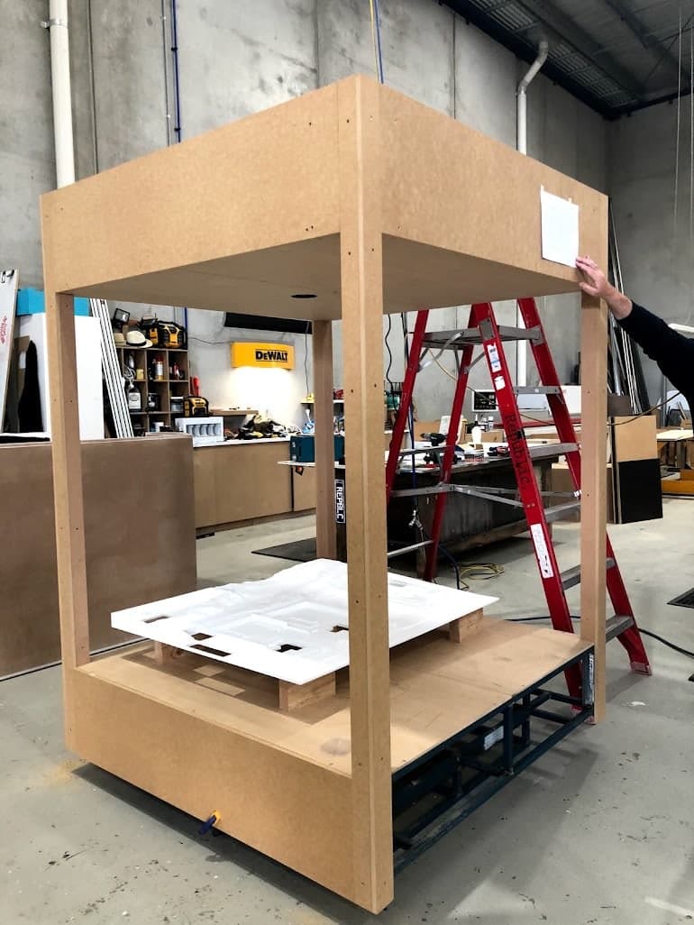 The H2.0 structure and physical water-network model being assembled in a workshop.